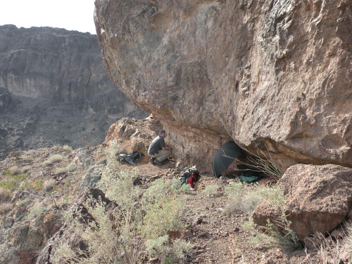 Graduate student Bryan Kaproth works at the Whipple detachment fault zone in southeastern CA.